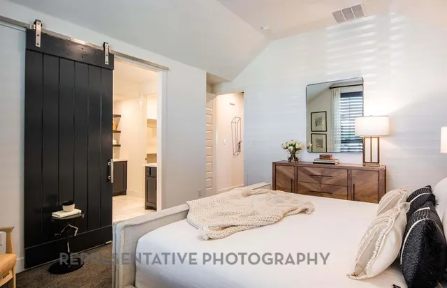 a bedroom with a bed and a table