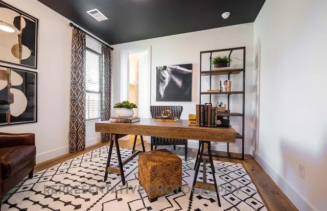 a view of a workspace with furniture