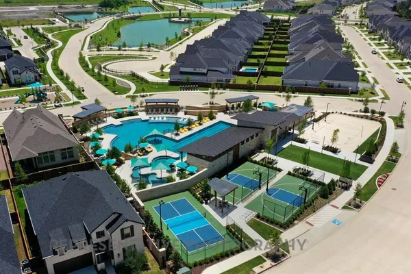 a view of a swimming pool and a yard