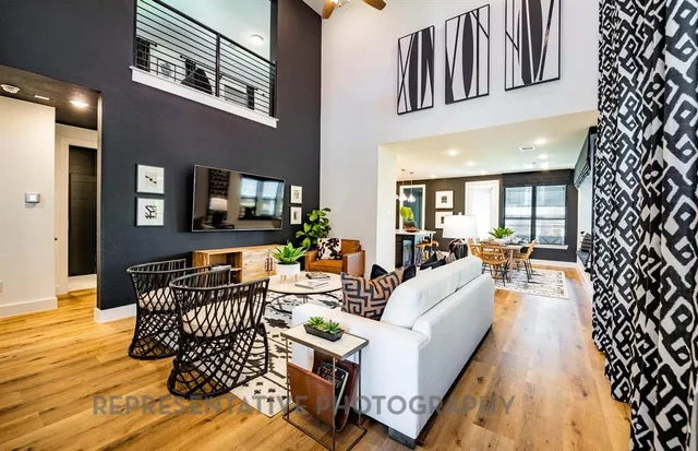 a living room with fireplace furniture and a wooden floor