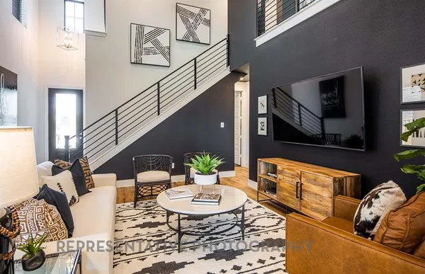 a living room with furniture fireplace and a flat screen tv