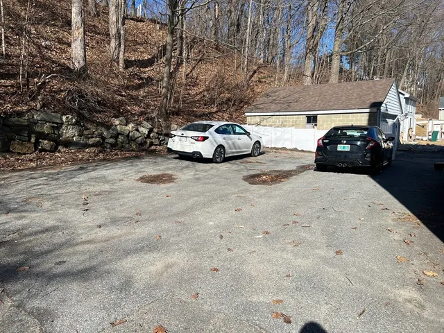 a view of a car parked in front of a building