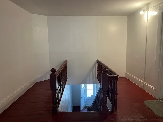 a view of entryway with wooden floor