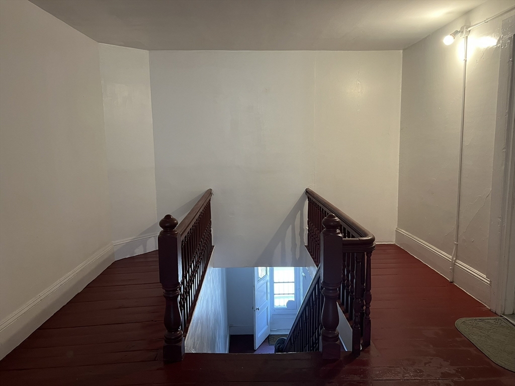 272 Front Street, Unit 5 Manchester, NH 03102 - Photo 15 of 19 a view of entryway with wooden floor