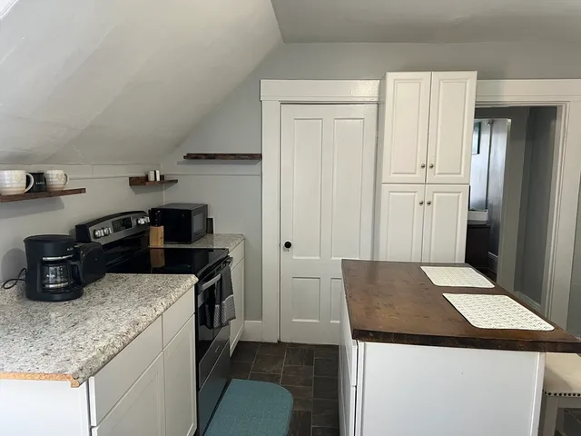 a kitchen that has a sink and a stove