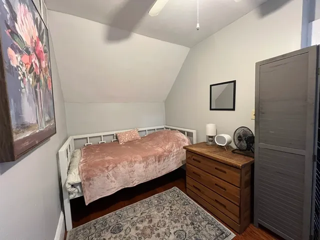 a bedroom with bed and a window