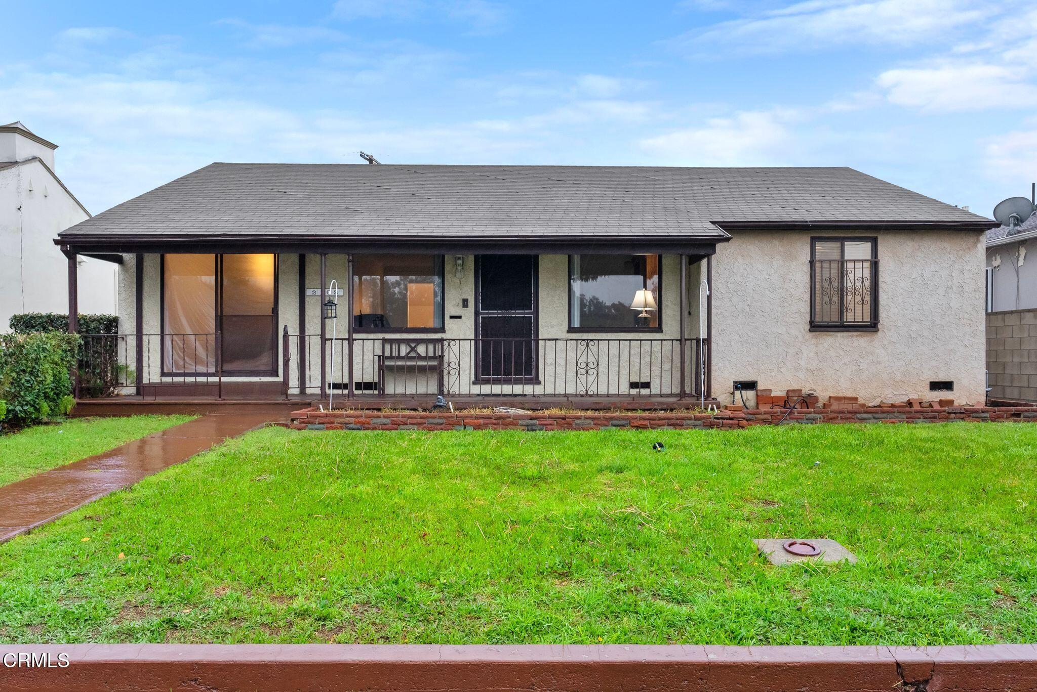 2102 North Eastern Avenue Los Angeles, CA 90032 - Photo 1 of 28 a backyard of a house with table and chairs