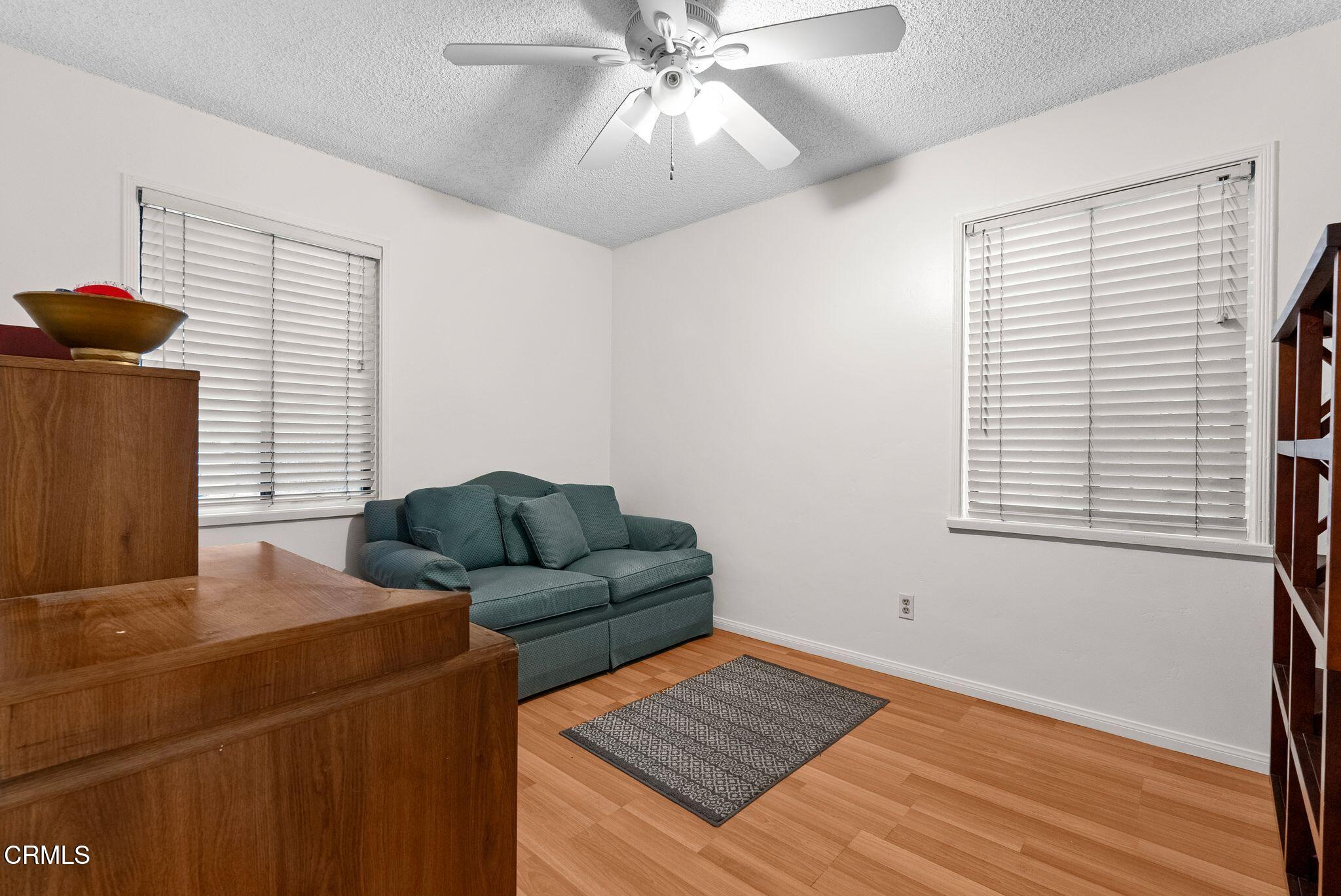 2102 North Eastern Avenue Los Angeles, CA 90032 - Photo 20 of 28 a living room with furniture and a window