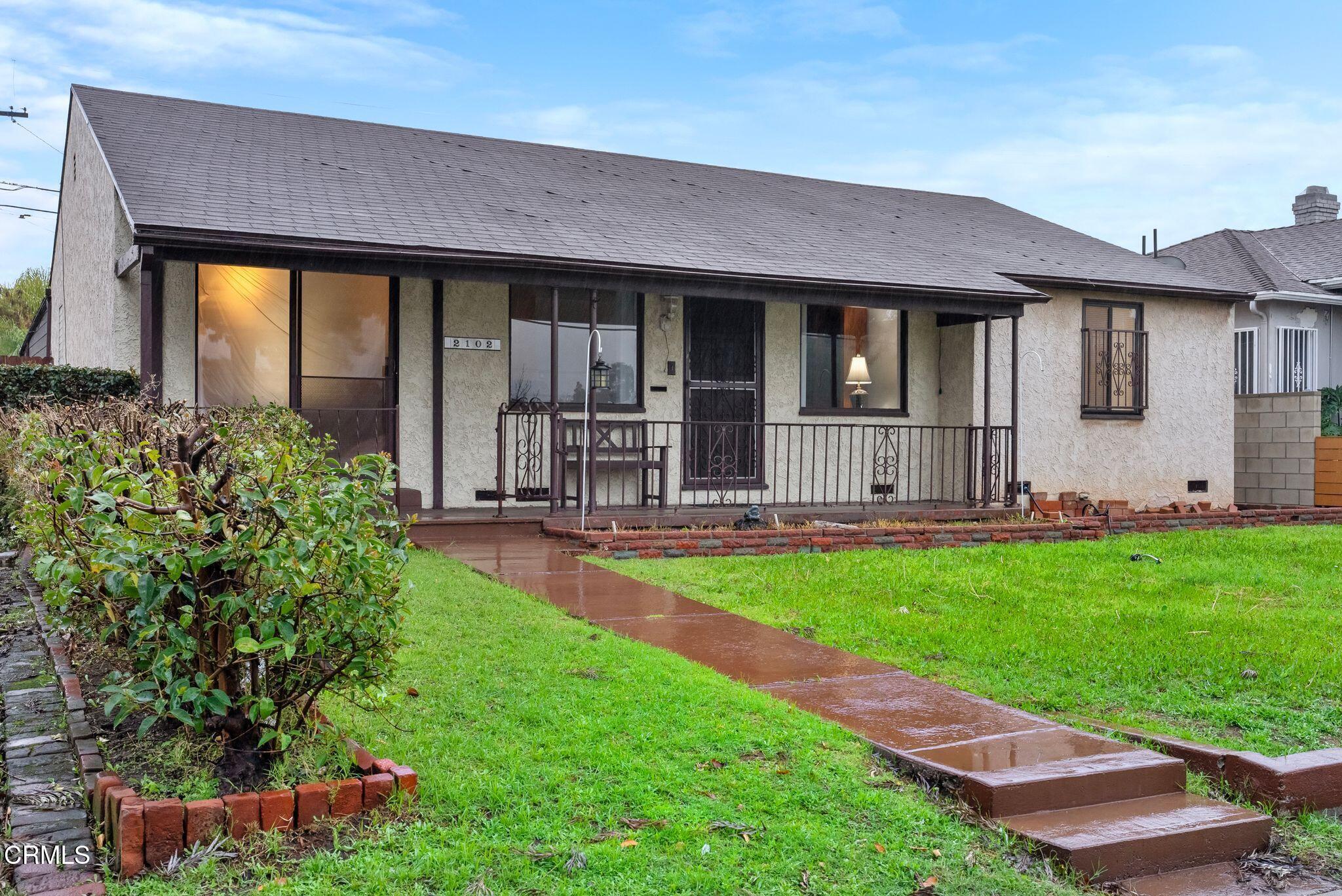 2102 North Eastern Avenue Los Angeles, CA 90032 - Photo 2 of 28 a front view of house with yard and outdoor seating