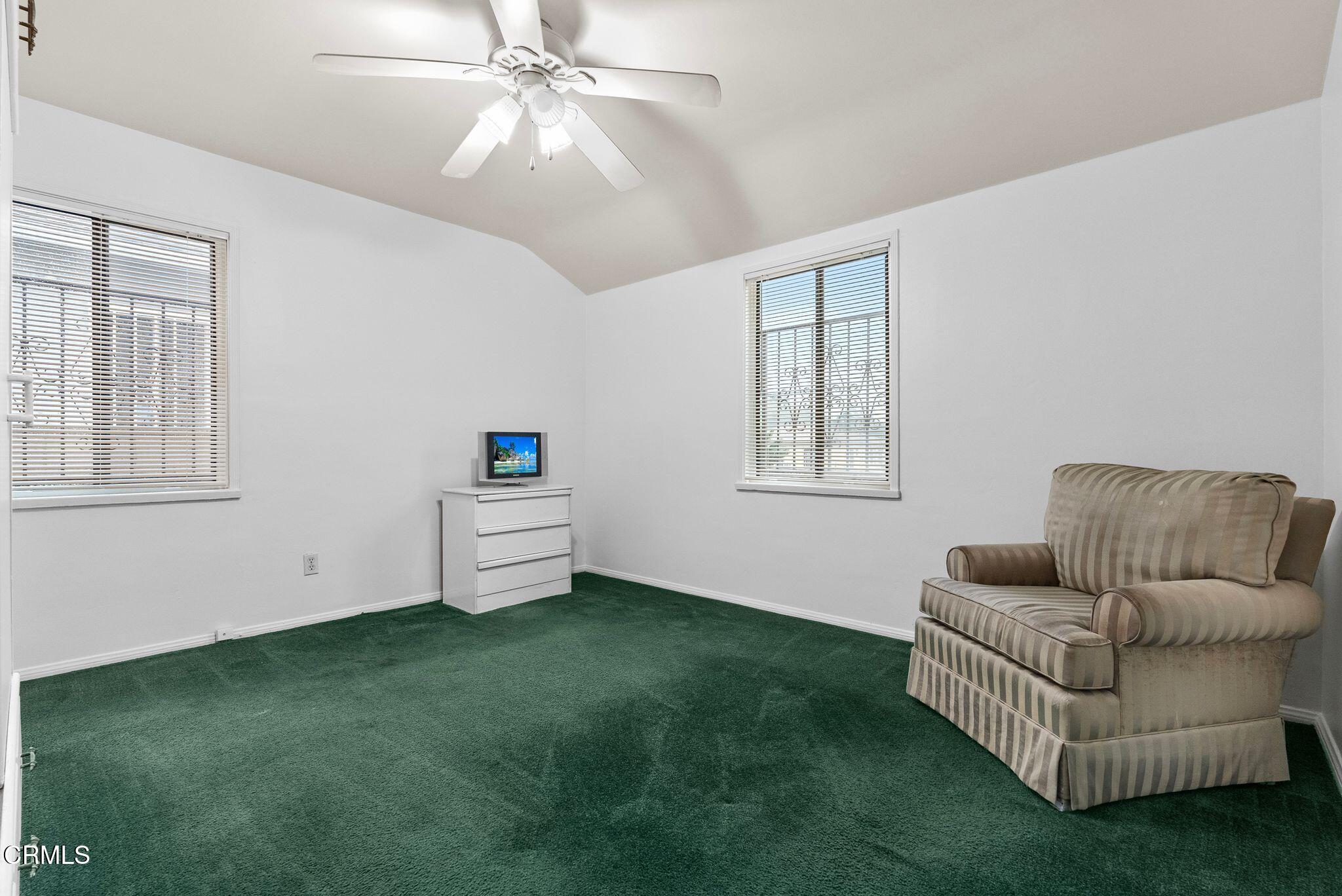 2102 North Eastern Avenue Los Angeles, CA 90032 - Photo 22 of 28 a living room with furniture and a window