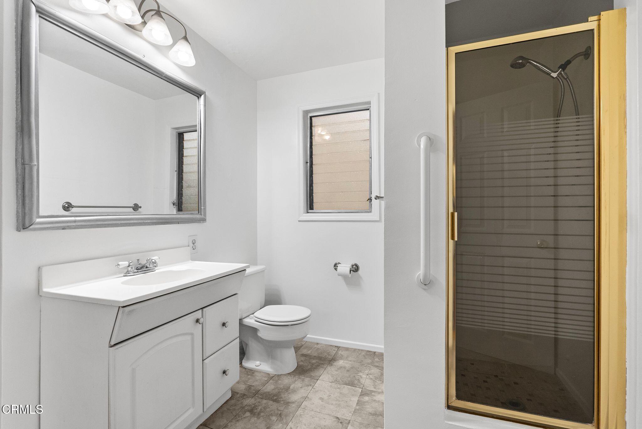 2102 North Eastern Avenue Los Angeles, CA 90032 - Photo 24 of 28 a bathroom with a sink a toilet and shower