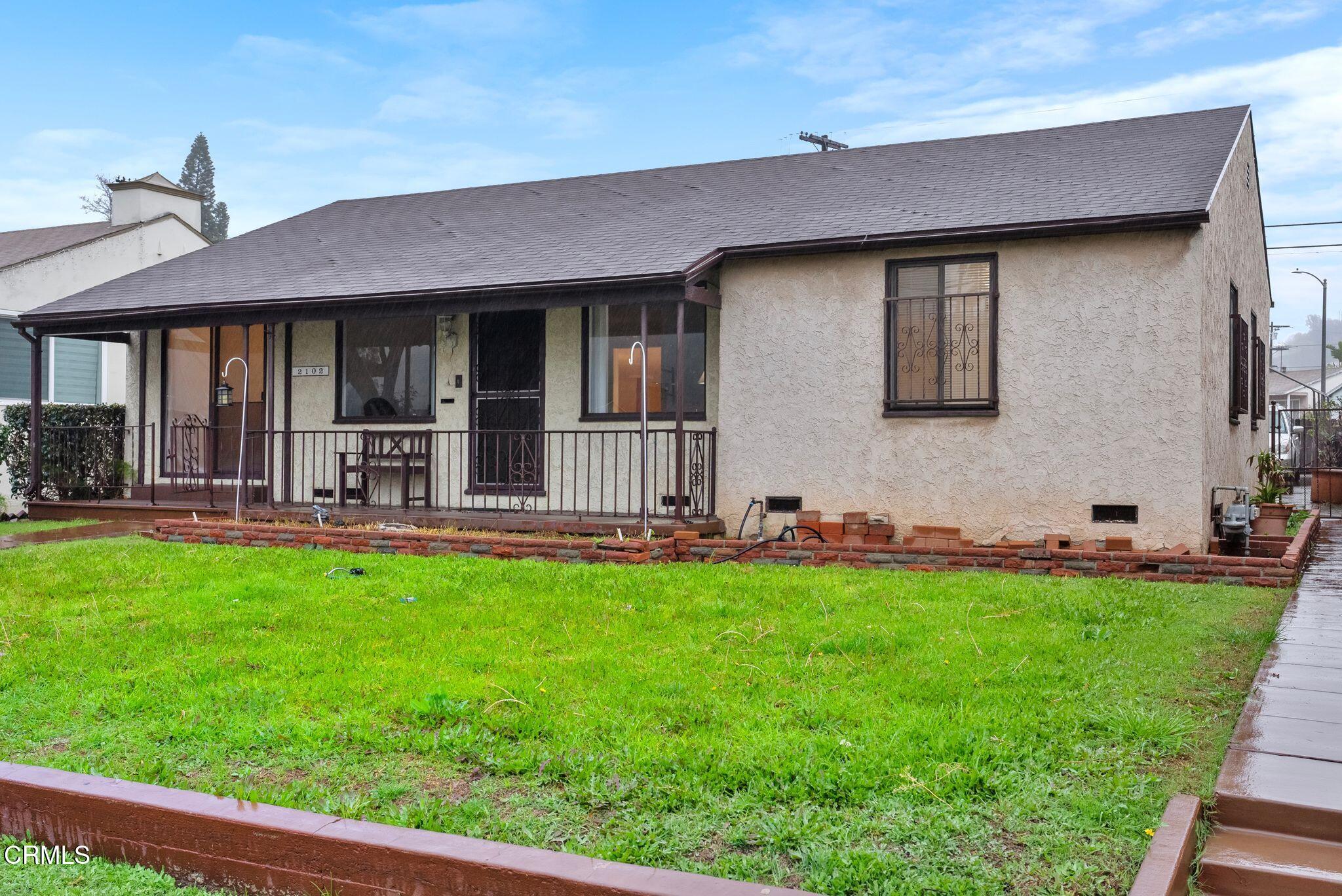 2102 North Eastern Avenue Los Angeles, CA 90032 - Photo 3 of 28 a backyard of a house with table and chairs