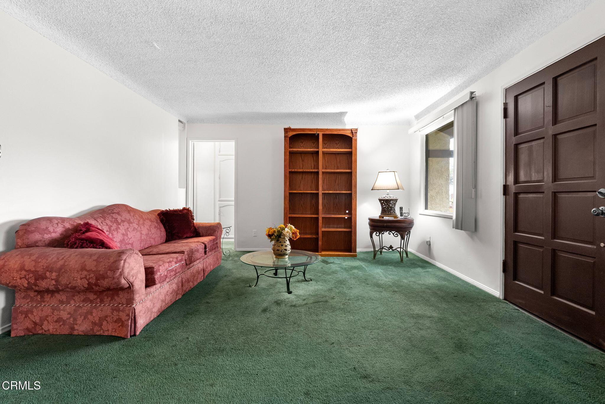 2102 North Eastern Avenue Los Angeles, CA 90032 - Photo 6 of 28 a living room with furniture and a gate