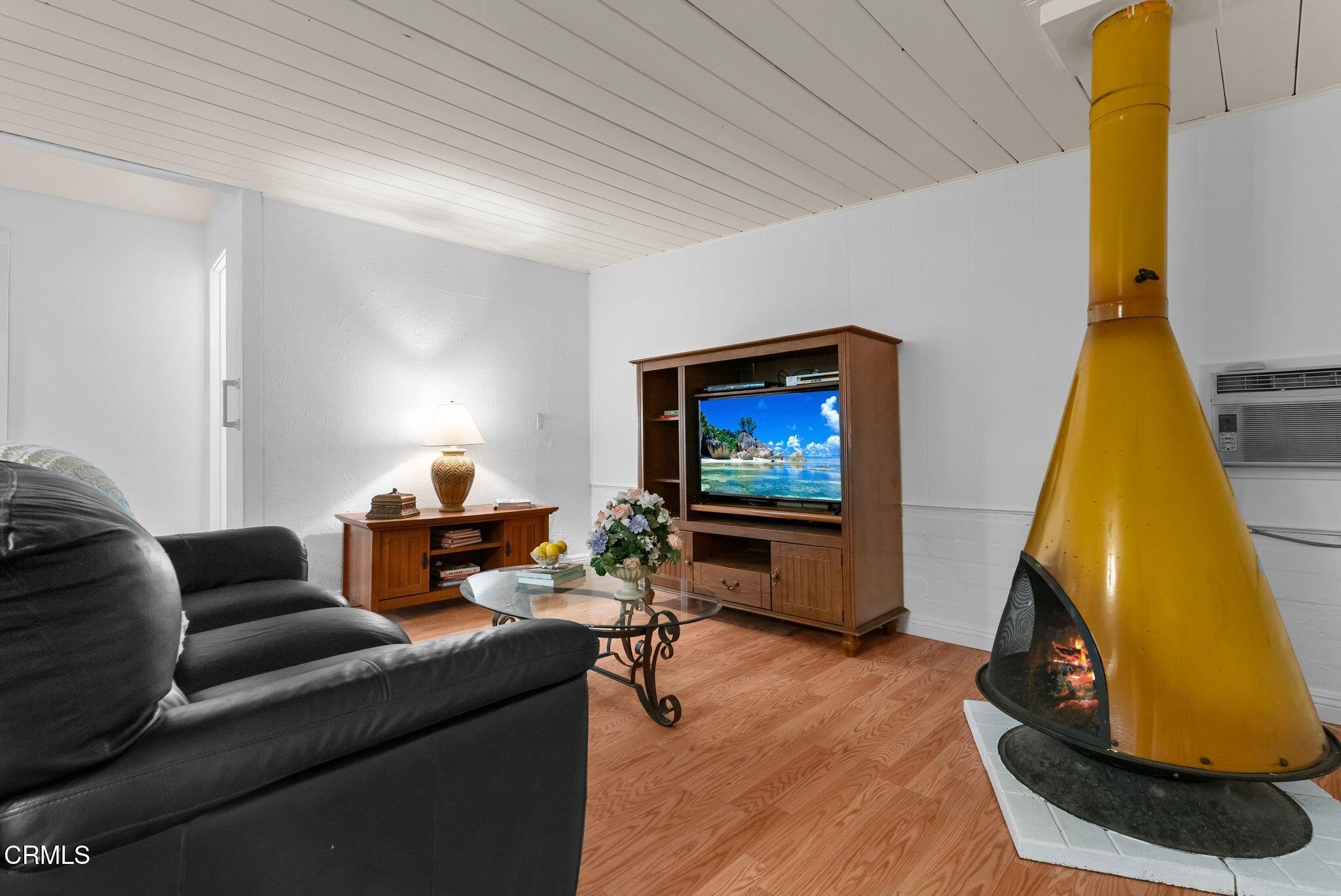 2102 North Eastern Avenue Los Angeles, CA 90032 - Photo 10 of 28 a living room with furniture and a flat screen tv
