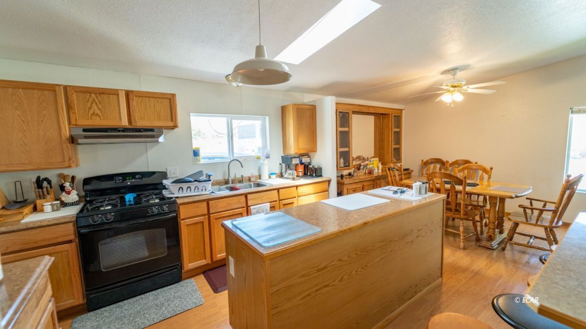 20 Primeaux Canyon Road Eureka, NV 89316 - Photo 14 of 24 a kitchen with a stove a sink and a refrigerator
