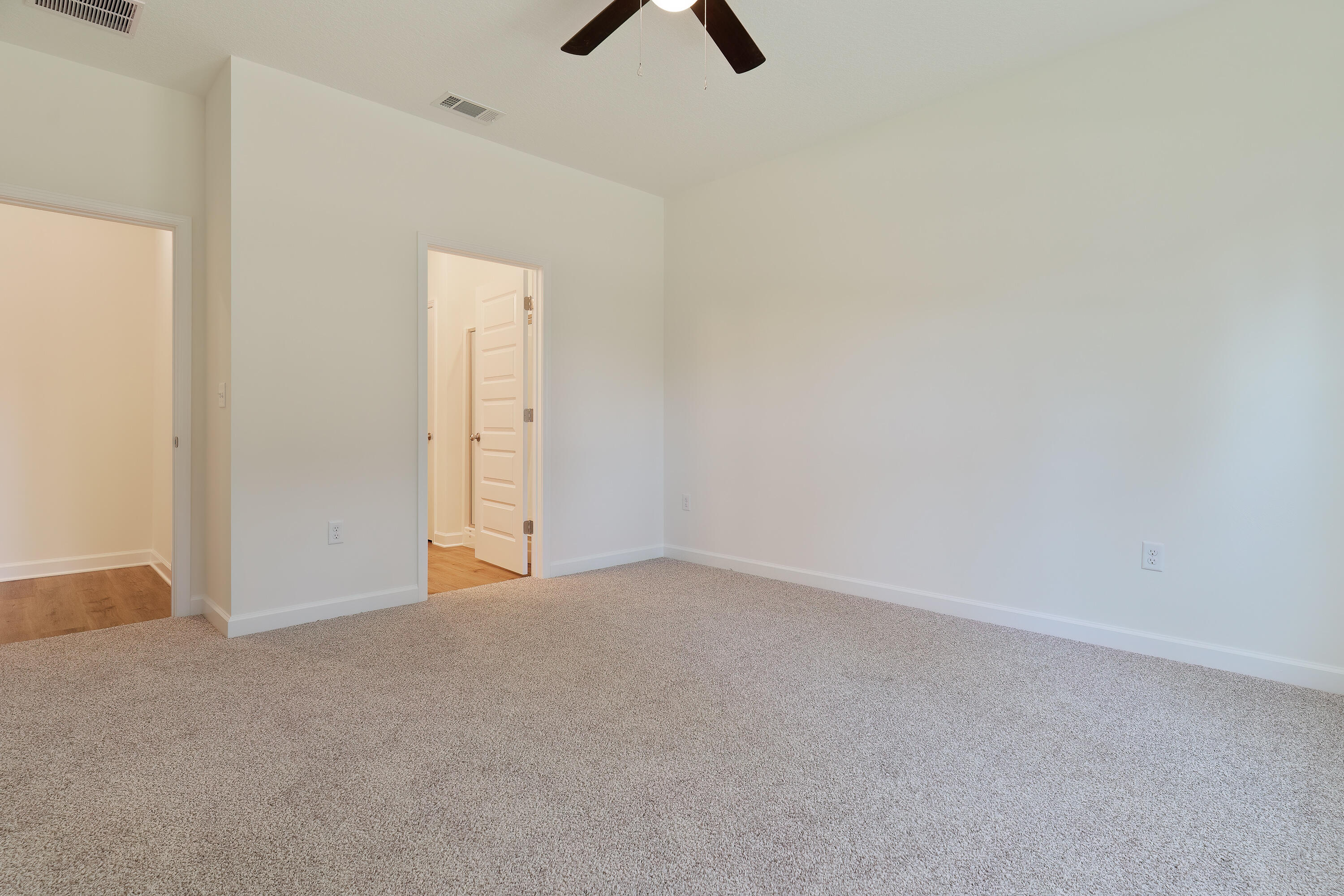4339 Cooper Lane Holt, FL 32564 - Photo 10 of 16 an empty room with closet and windows
