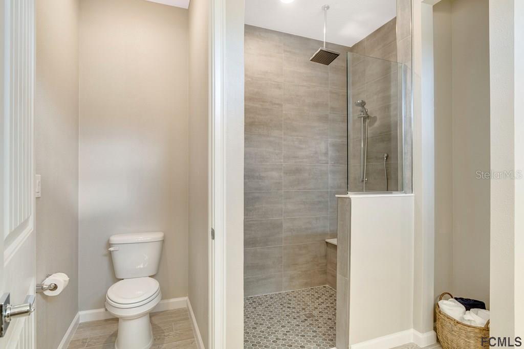 584 Octavius Road Southwest Palm Bay, FL 32908 - Photo 16 of 30 a bathroom with a toilet and a shower