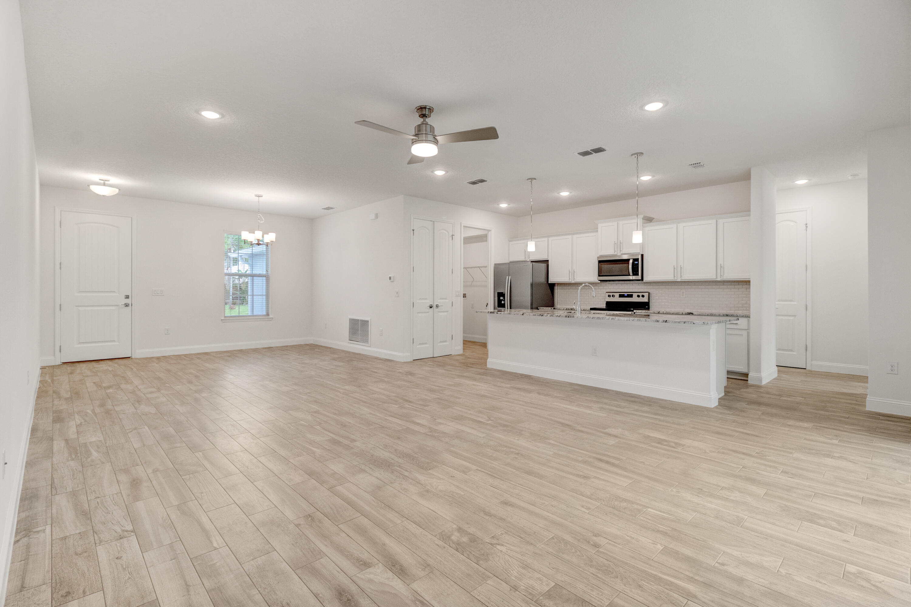 584 Octavius Road Southwest Palm Bay, FL 32908 - Photo 20 of 30 a view of kitchen with refrigerator and window