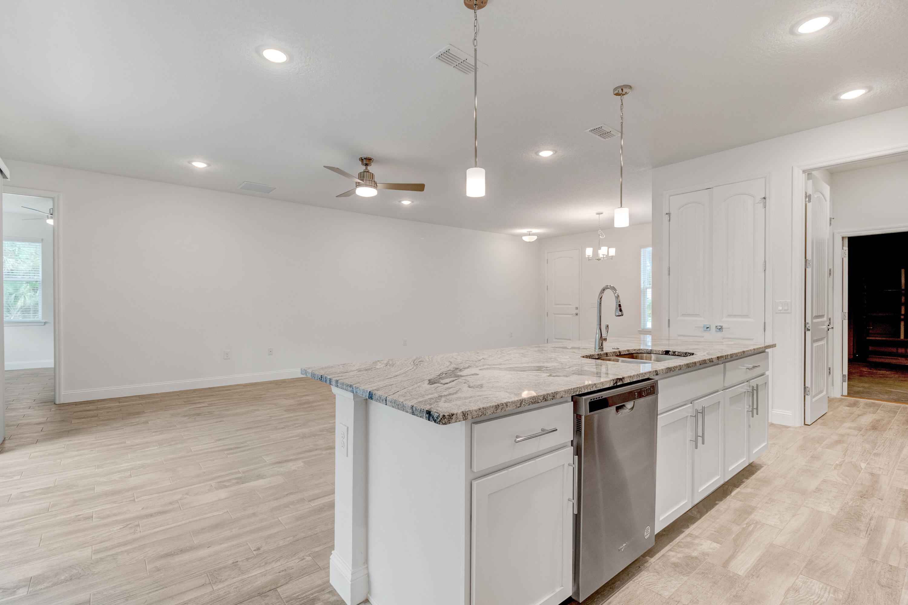 584 Octavius Road Southwest Palm Bay, FL 32908 - Photo 23 of 30 a kitchen with a sink and chandelier