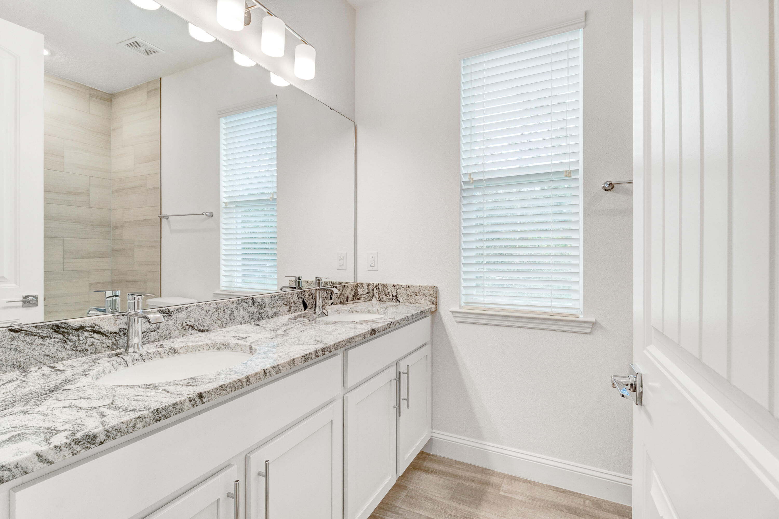 584 Octavius Road Southwest Palm Bay, FL 32908 - Photo 26 of 30 a bathroom with a granite countertop sink and a window