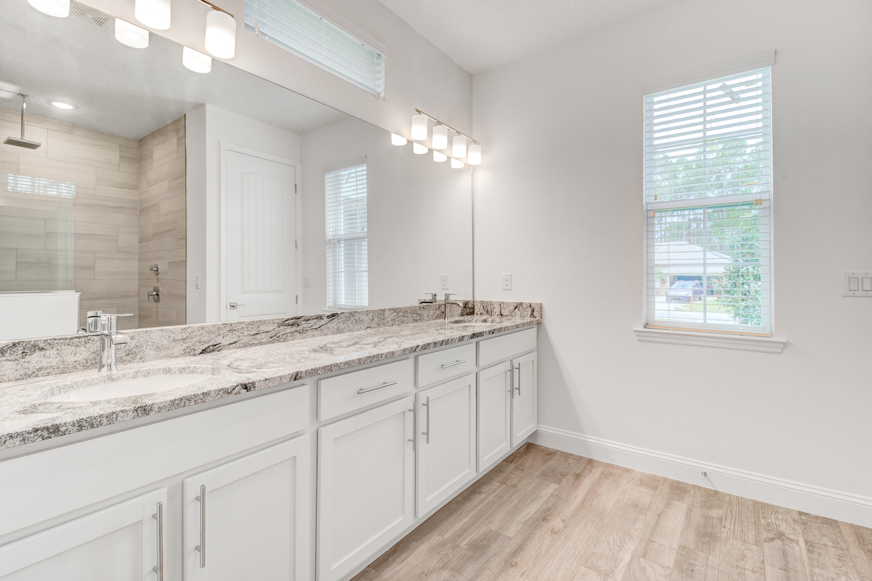 584 Octavius Road Southwest Palm Bay, FL 32908 - Photo 29 of 30 a bathroom with double vanity and a mirror