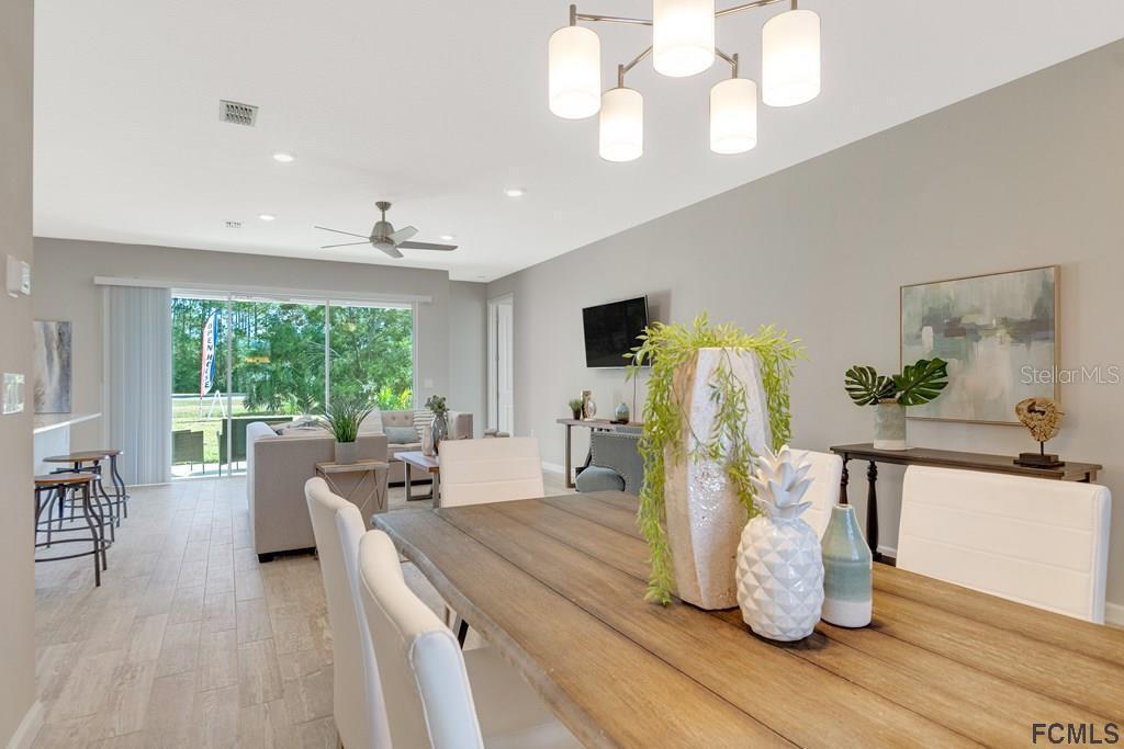 584 Octavius Road Southwest Palm Bay, FL 32908 - Photo 8 of 30 a living room with furniture and a large window