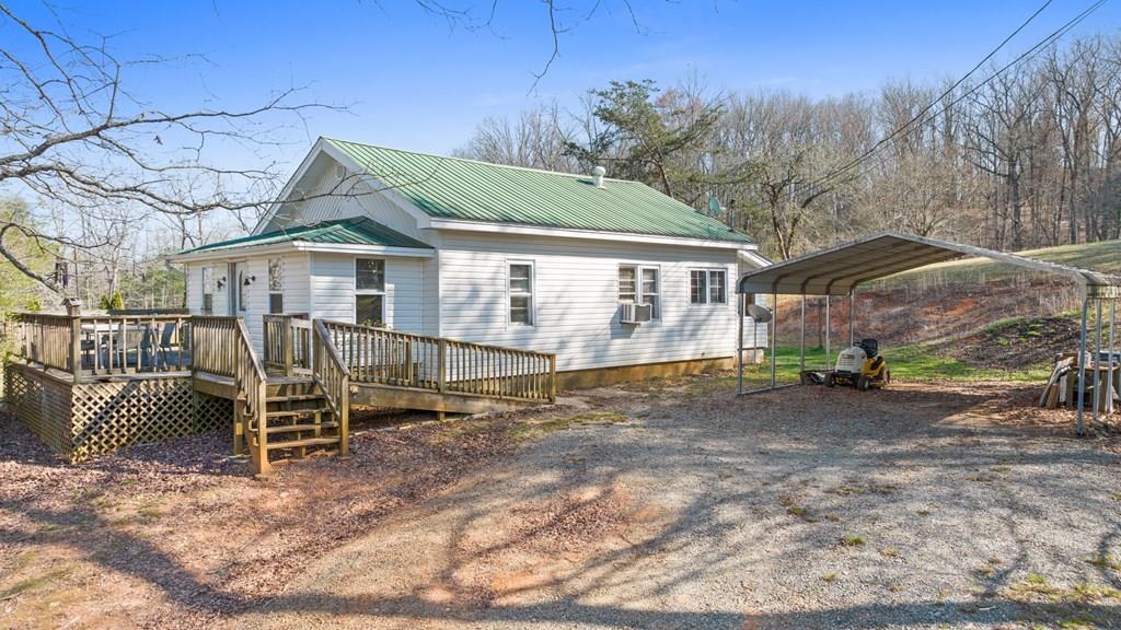 4170 Old Highway 5 Blue Ridge, GA 30513 - Photo 1 of 29 a view of a house with a yard chairs and roof
