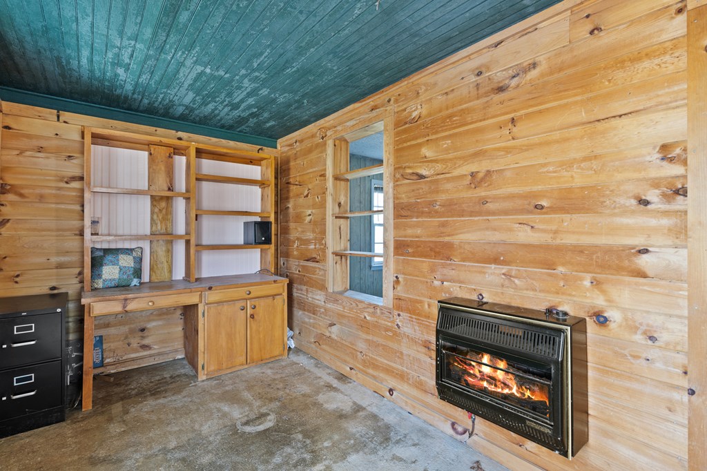 4170 Old Highway 5 Blue Ridge, GA 30513 - Photo 13 of 29 a kitchen with a wooden floor and a fireplace