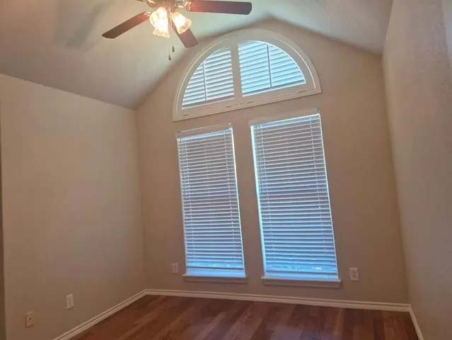 a spacious bathroom with a double vanity sink a mirror and a bathtub