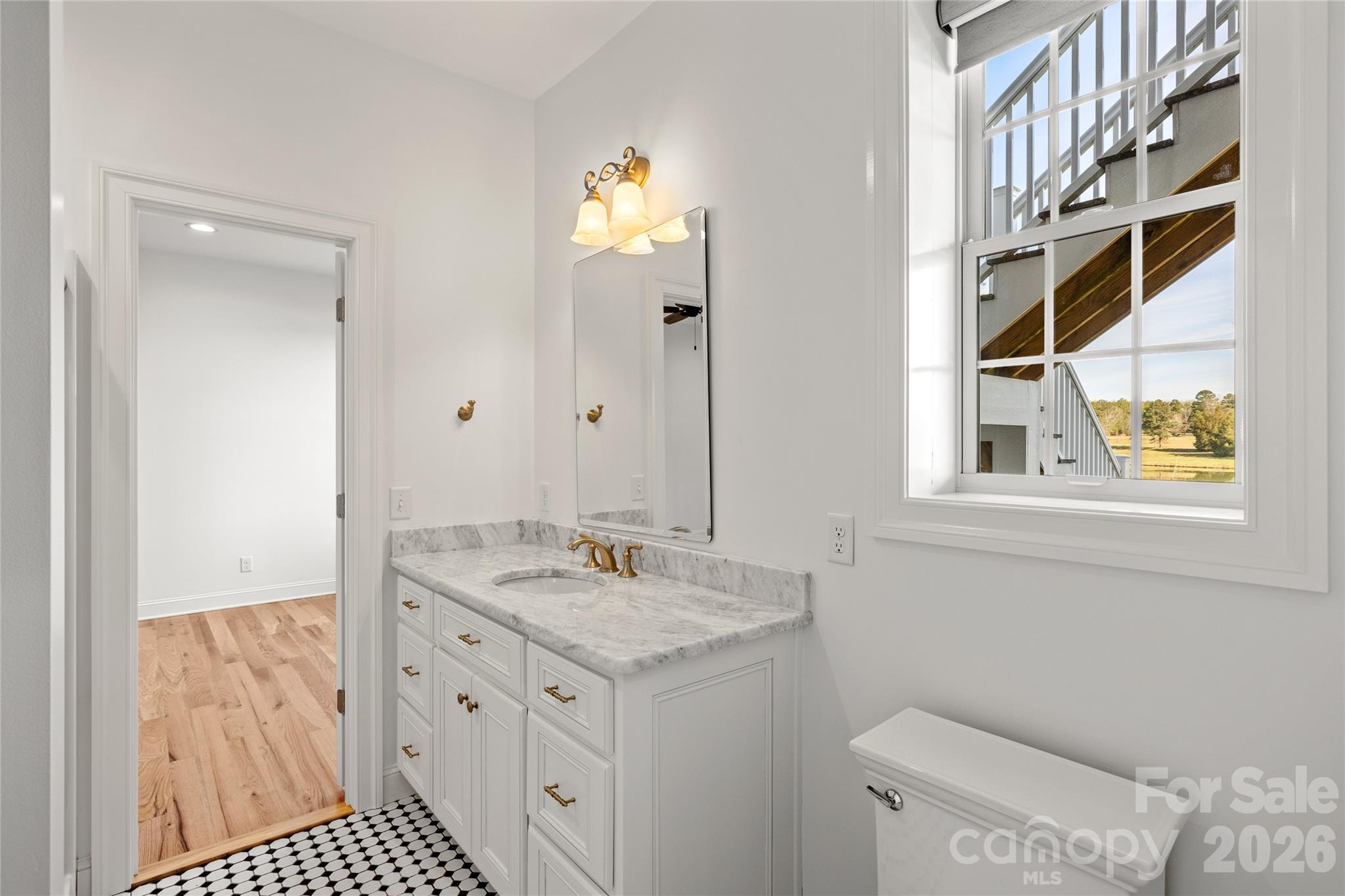 490 Mapleton Lane Columbus, NC 28722 - Photo 37 of 42 a bathroom with a sink a vanity and a mirror