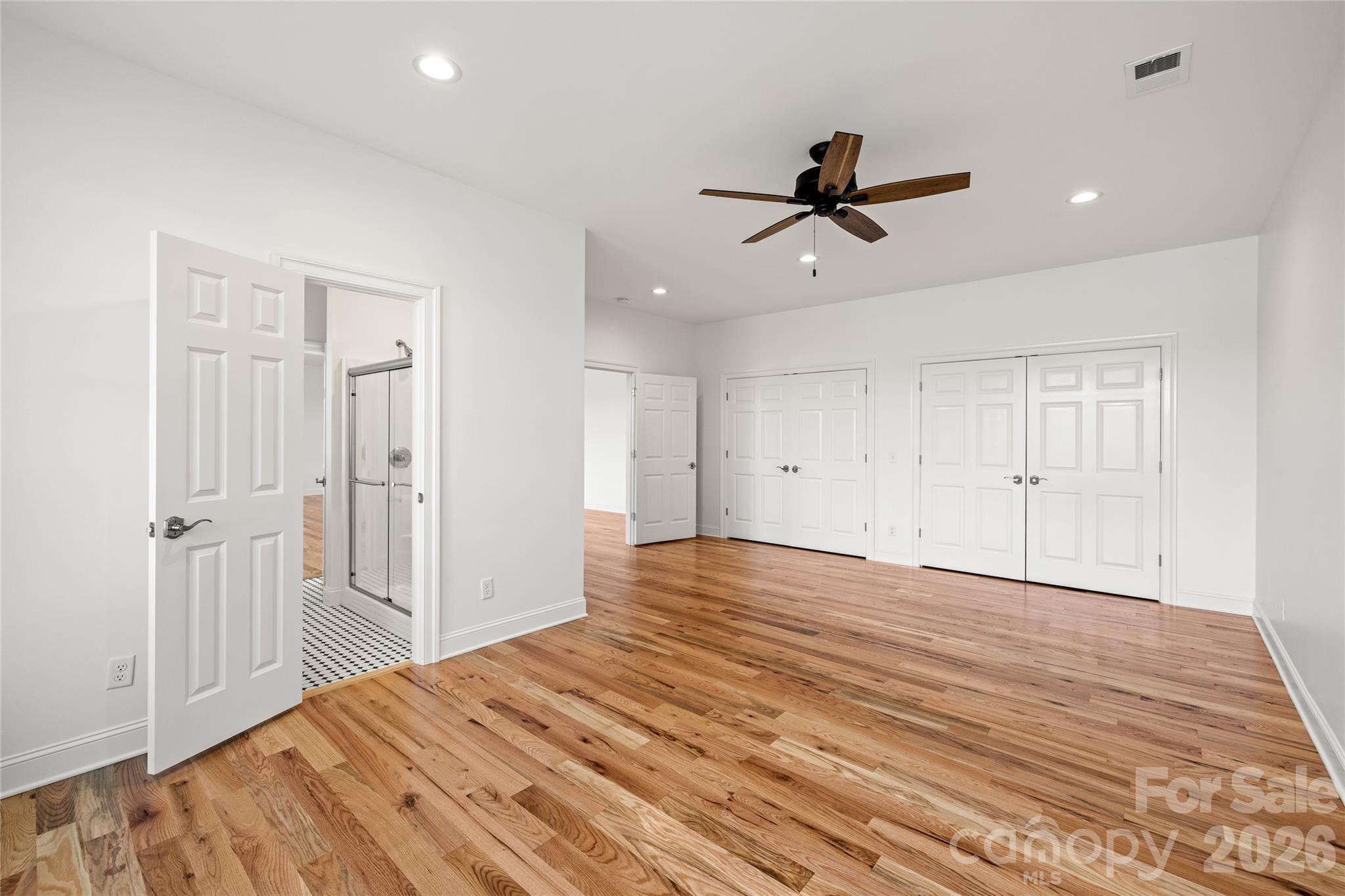 490 Mapleton Lane Columbus, NC 28722 - Photo 38 of 42 a view of a room with wooden floor and ceiling fan
