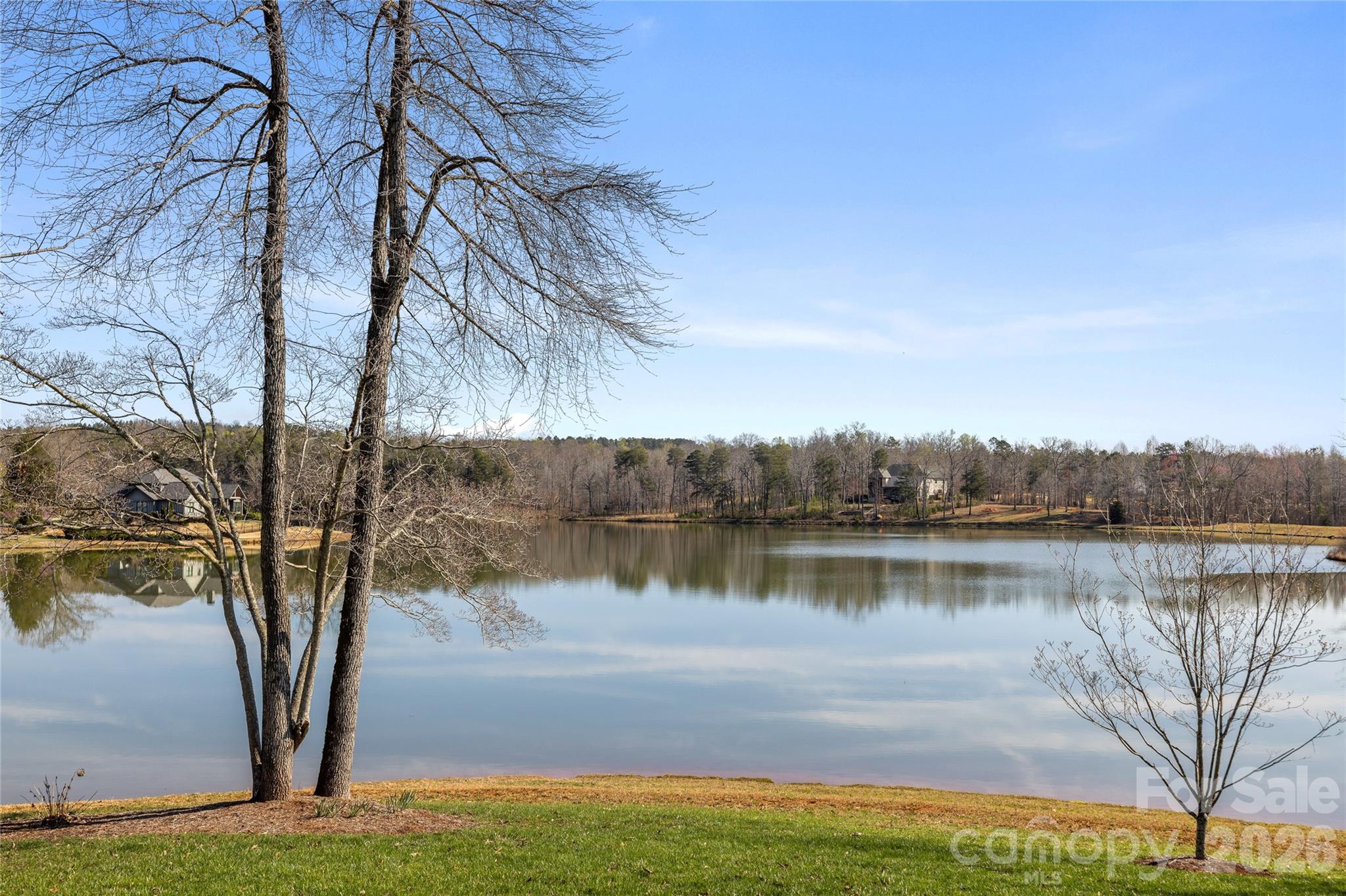 490 Mapleton Lane Columbus, NC 28722 - Photo 40 of 42 a view of a lake with houses in the back