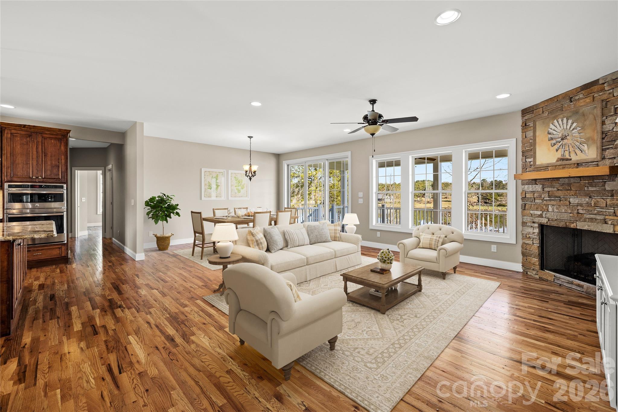 490 Mapleton Lane Columbus, NC 28722 - Photo 7 of 42 a living room with furniture large window and wooden floor