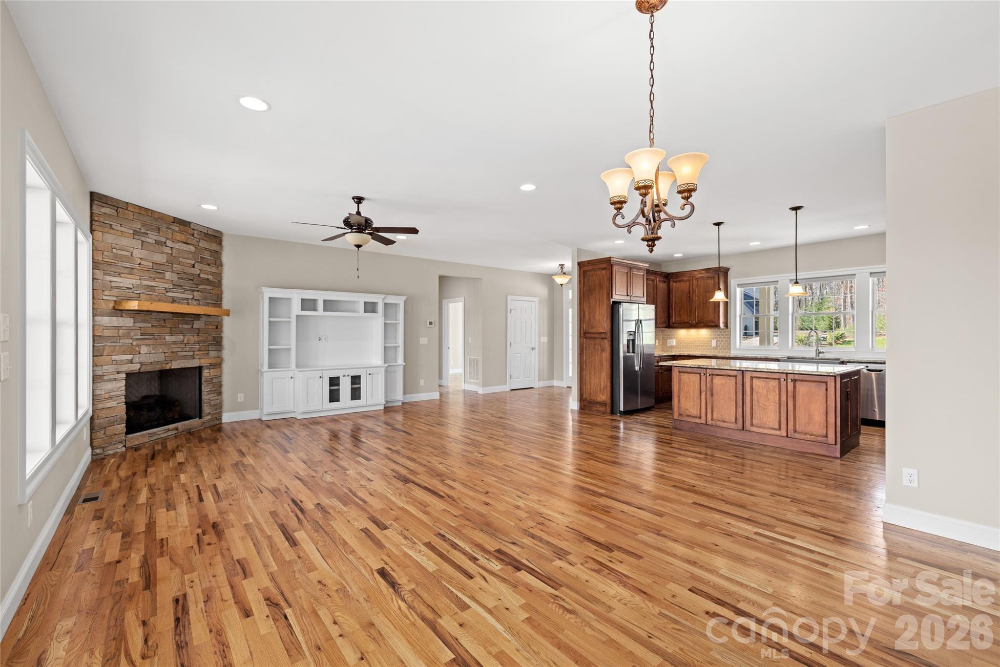 490 Mapleton Lane Columbus, NC 28722 - Photo 10 of 42 a view of a kitchen with granite countertop stove top oven and cabinets