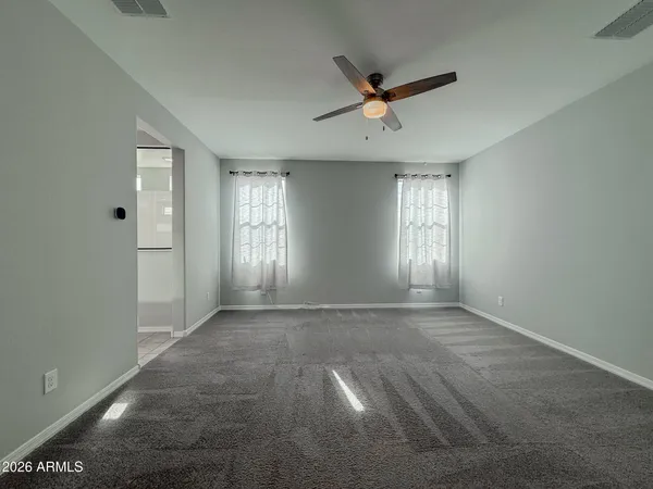 a view of an empty room with a window