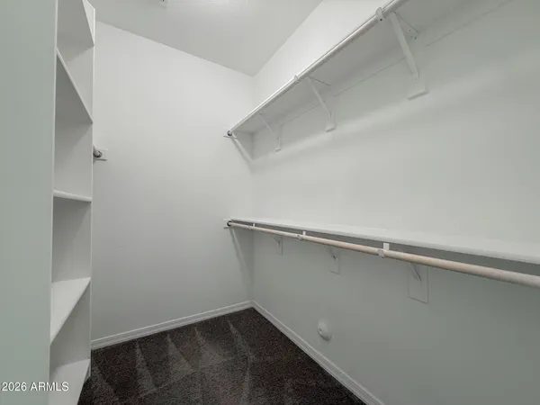 a view of hallway with wooden floor