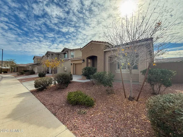 a front view of a house with garden