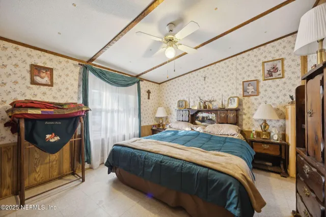 a bedroom with a bed and a mirror