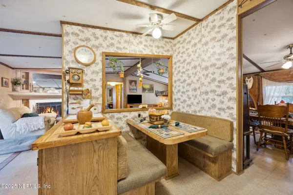 a dining room with furniture and window