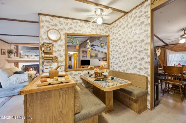 a dining room with furniture and window