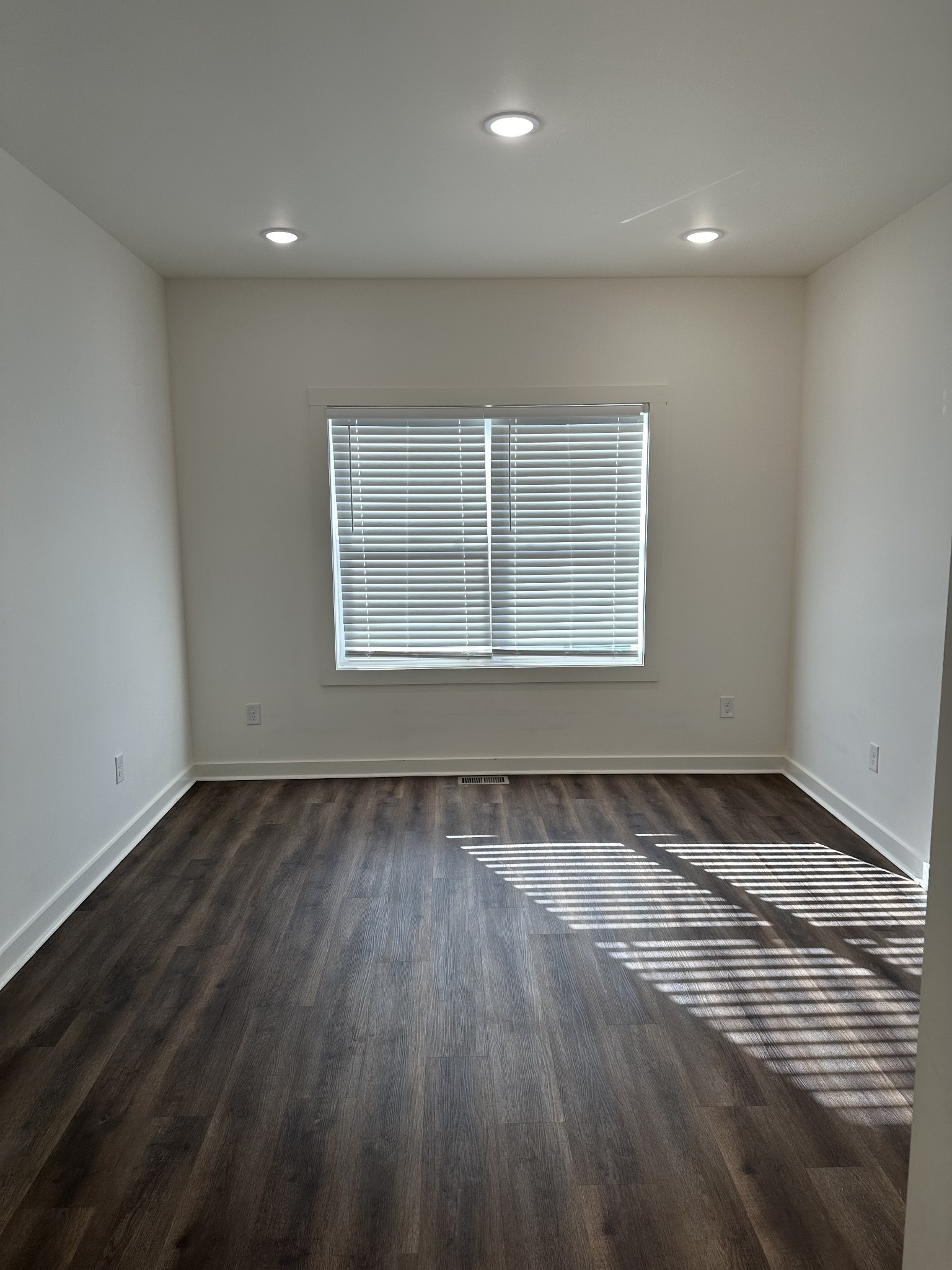 65 Duncan Lane Winchester, TN 37398 - Photo 10 of 11 a view of an empty room with wooden floor and a window
