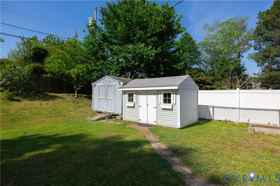 9217 Fisk Road Richmond, VA 23229 - Photo 35 of 39 a view of a house with a yard