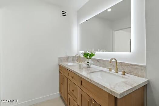 2949 North 29th Street Phoenix, AZ 85016 - Photo 15 of 28 a bathroom with a sink and a mirror