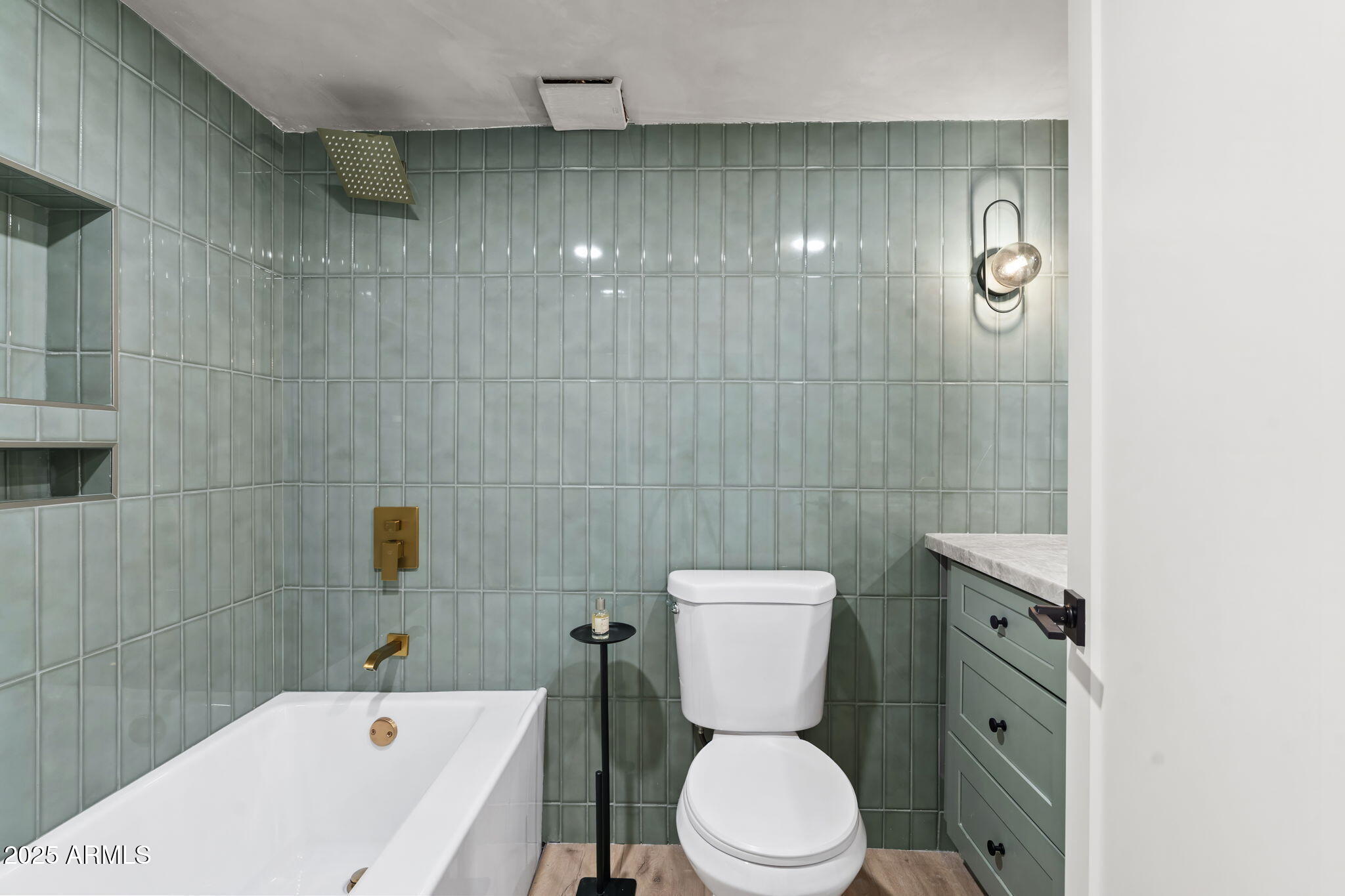 2949 North 29th Street Phoenix, AZ 85016 - Photo 17 of 28 a white toilet sitting next to a bathroom sink