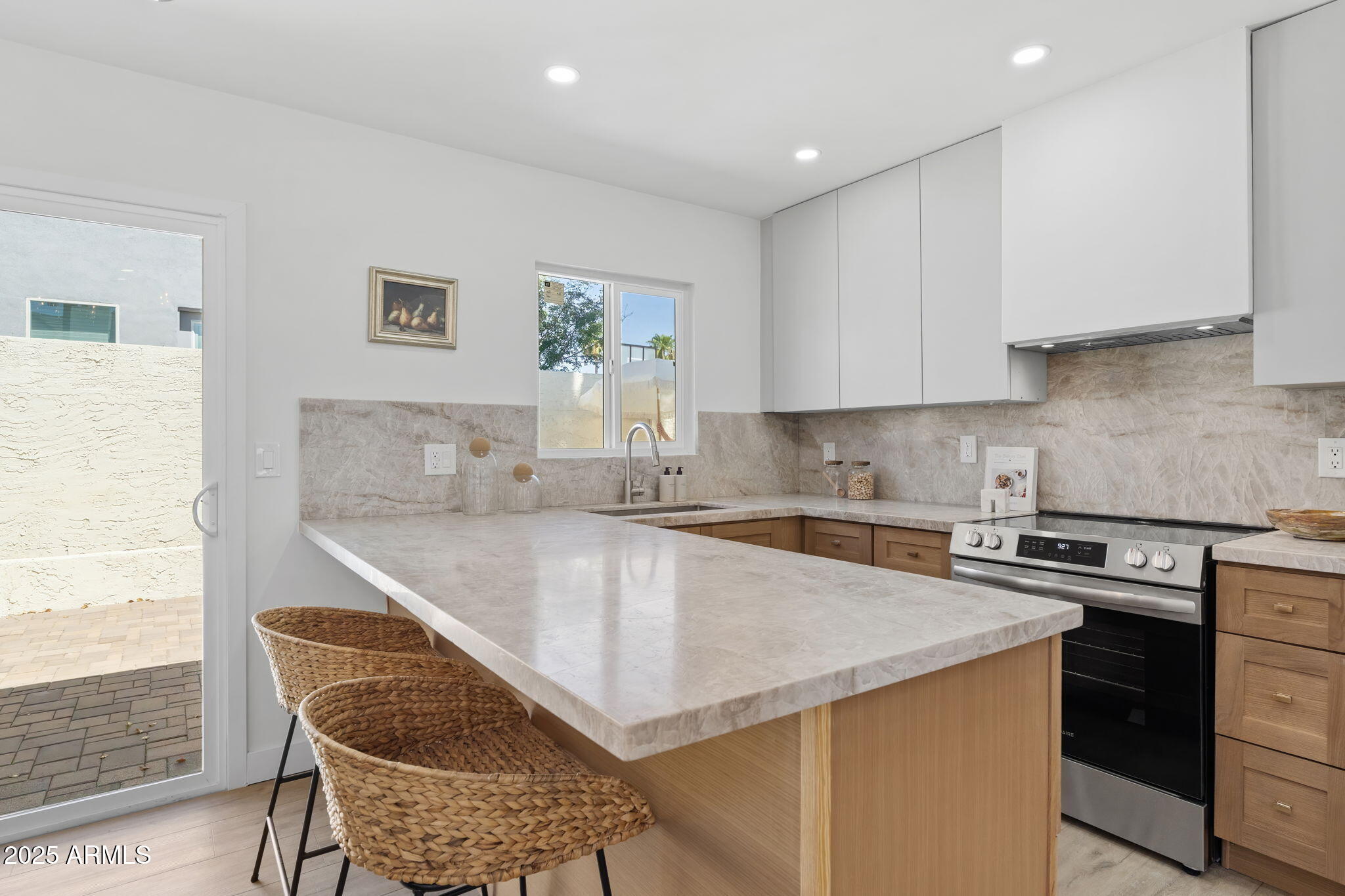 2949 North 29th Street Phoenix, AZ 85016 - Photo 6 of 28 a kitchen with a stove a sink and a refrigerator