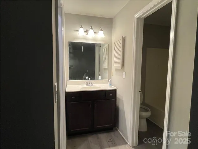 a bathroom with a double vanity sink and mirror