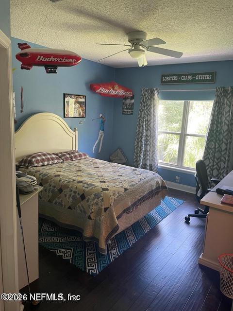 232 South Hampton Club Way St. Augustine, FL 32092 - Photo 24 of 55 a bedroom with a bed and a dresser with wooden floor