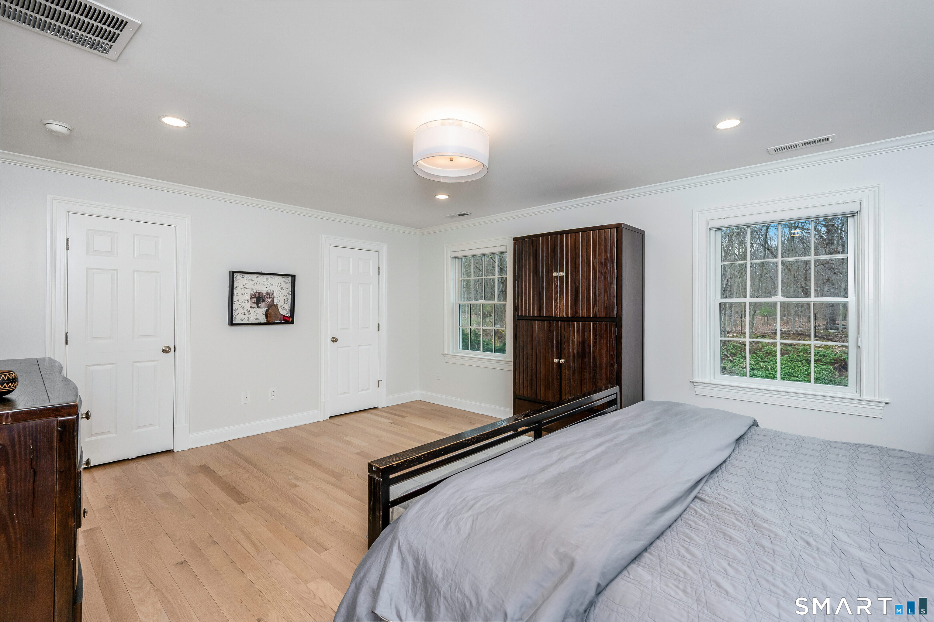 34 Intervale Road Darien, CT 06820 - Photo 14 of 36 a bedroom with a bed and a window
