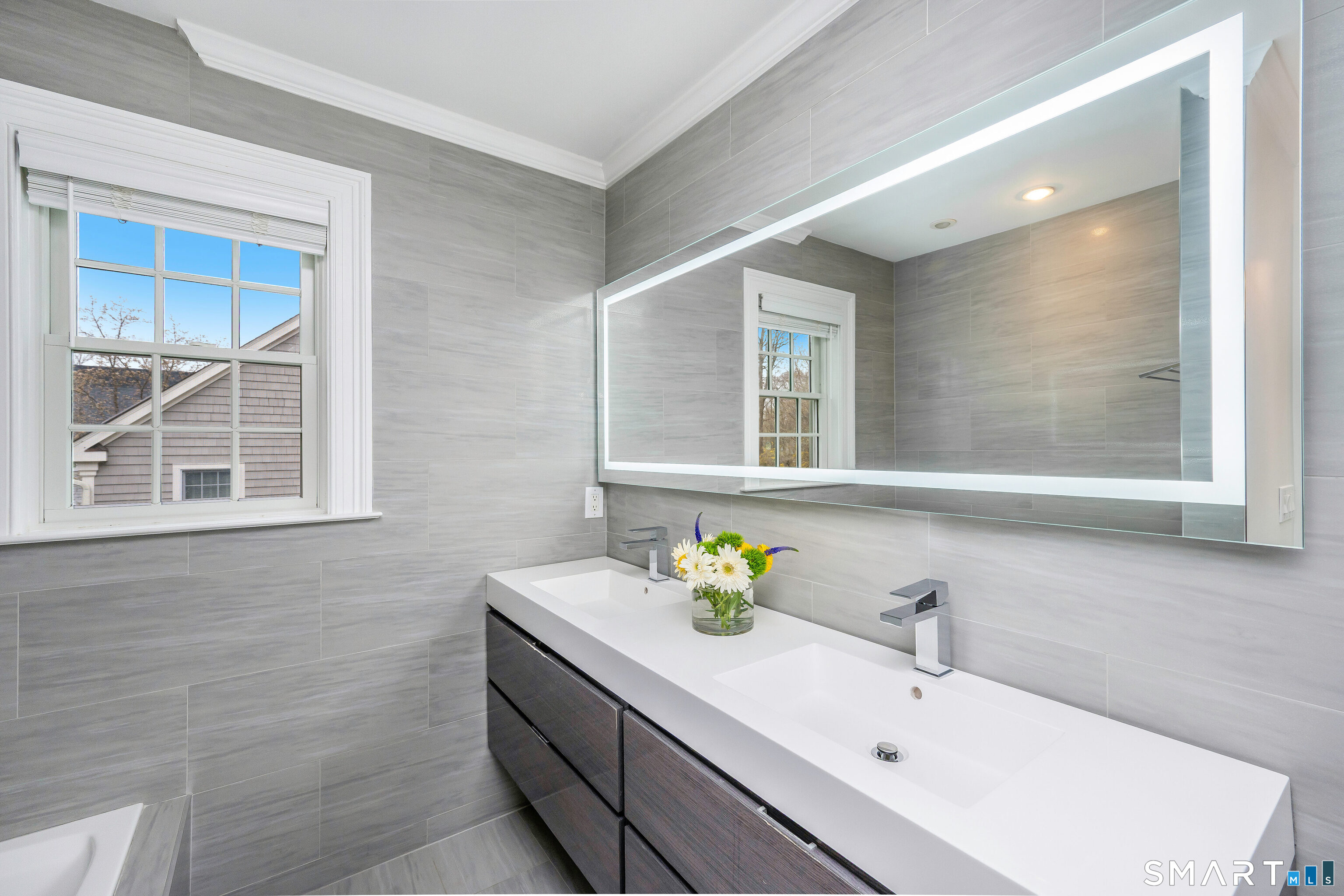 34 Intervale Road Darien, CT 06820 - Photo 16 of 36 a bathroom with a sink and a bathtub