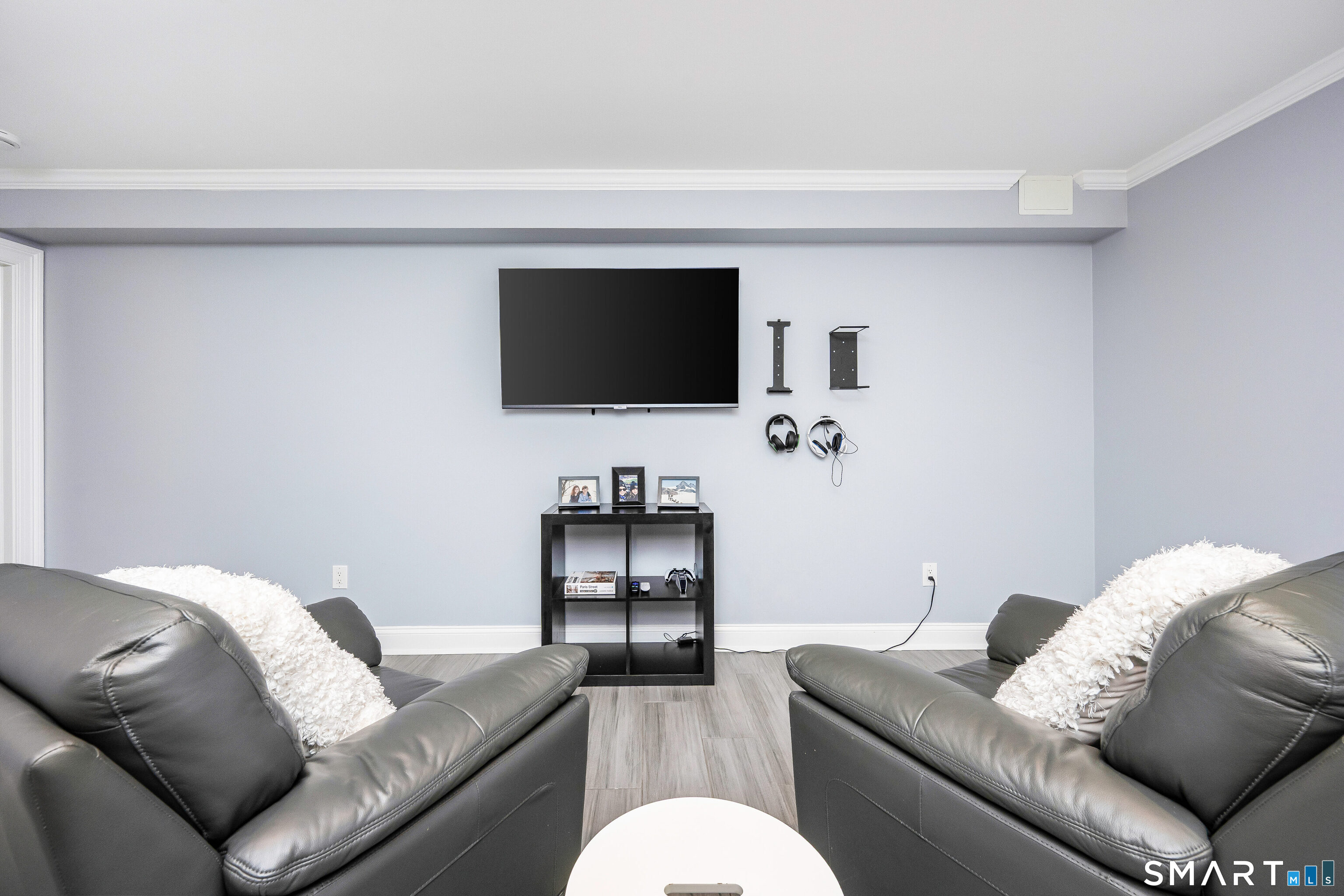 34 Intervale Road Darien, CT 06820 - Photo 23 of 36 a living room with furniture and a flat screen tv